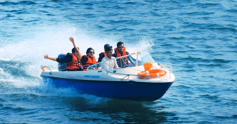 people with speed boat at the middile of the sea